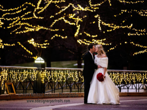 Bride and groom taking a romantic stroll in the beautiful twinkle lights at their Carlson Towers wedding reception.