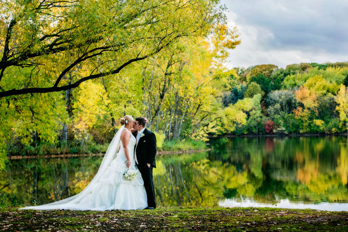 Beautiful Fall color reflection in a lake from Pete and Lauren's King of Kings Lutheran Church and Prestwick Golf Club Wedding Reception.