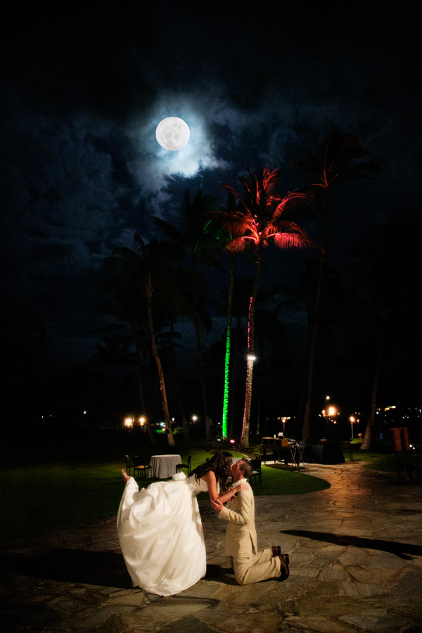 Hawaiian destination wedding. Bride and groom's first dance under the moonrise at Hilton Waikoloa Village. After enhancement.