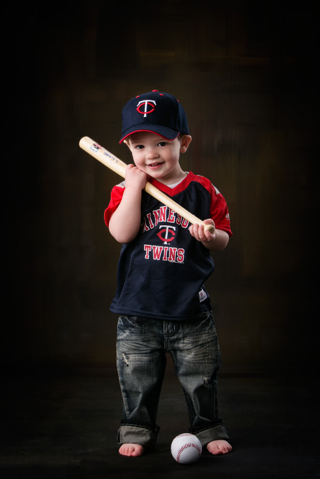 Two year old portraits of Logan in his Minnesota Twins outfit.