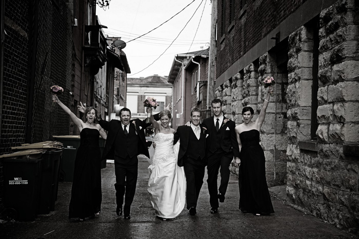 Bride, groom and their wedding party in downtown Stillwater, MN.