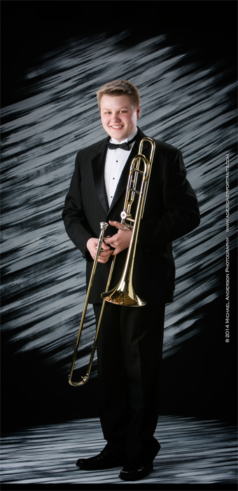 Centennial High School Senior Pictures of a senior and his trombone in his band tuxedo.