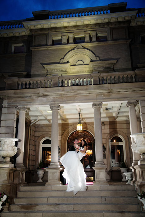 Semple Mansion wedding night image of the bride and groom on the front steps.
