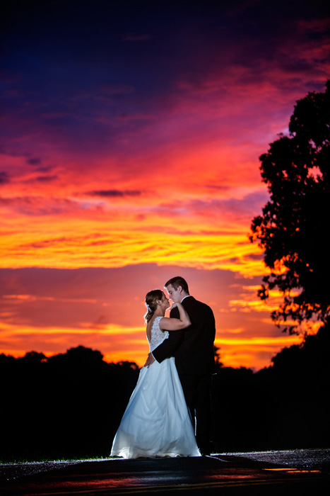 Withrow Ballroom wedding photograph of a bride and groom and an incredible post-rainstorm sunset!