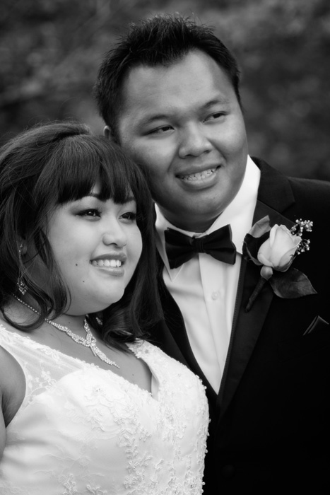 Close up black and white candid wedding photo of the bride and groom at their North Oaks Country Club wedding.