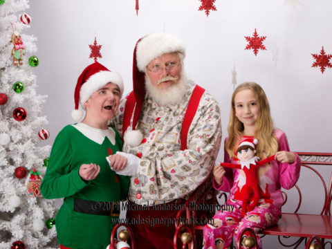 Eleven year old Jamie and his seven year old sister Riley stopped by Anderson's photography studio for their portraits with Santa Claus.