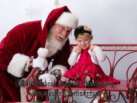 Santa Claus portrait photography of Morgan at the portrait studio of Michael Anderson Photography in Mounds View, MN. Image taken at their "Portraits with Santa Claus" special in November 2104. A charity fundraiser for the Ralph Reeder Food Shelf in New Brighton, MN.