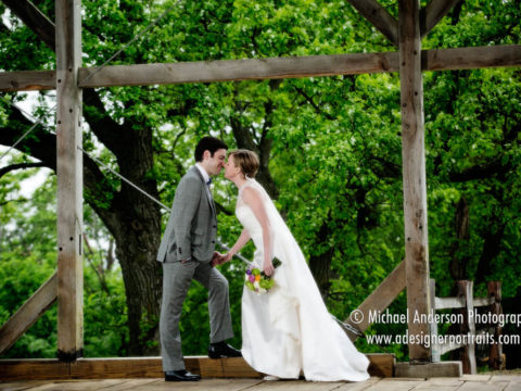 Bride and groom kissing on a rainy day at the Cannon River Vineyard on their Cannon River Winery wedding day.