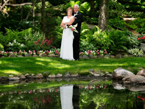 Beautiful photo of a bride and Groom at Mary's Pond at their Panola Valley Gardens wedding.