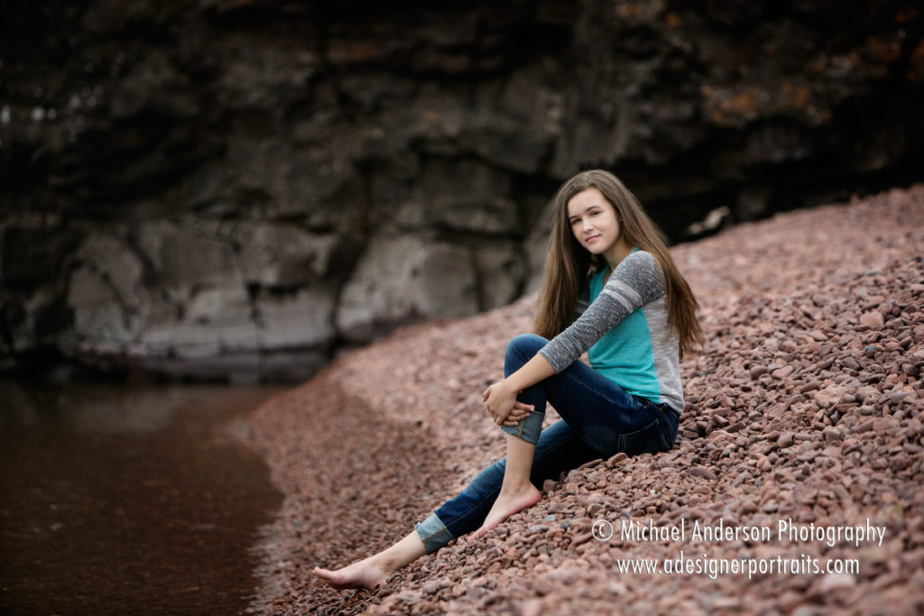 Maple Grove High School senior portraits taken on a rocky beach on Lake Superior.