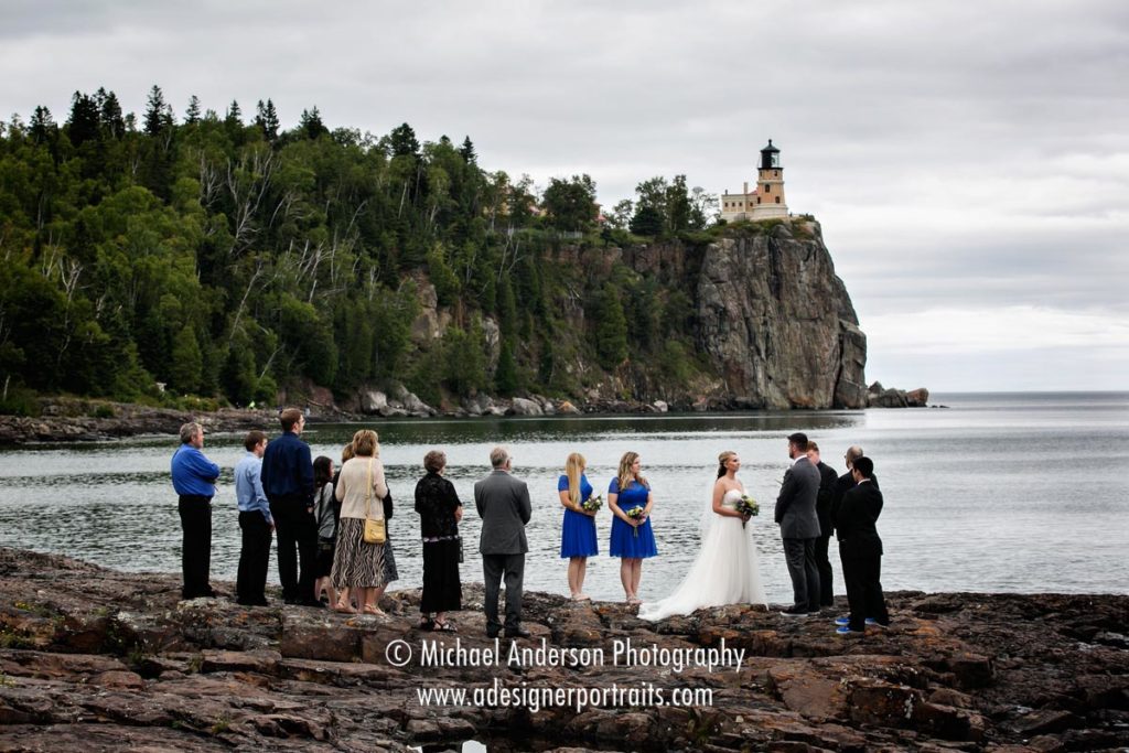 Split Rock Lighthouse wedding photography of the wedding ceremony with the famous lighthouse in the background.