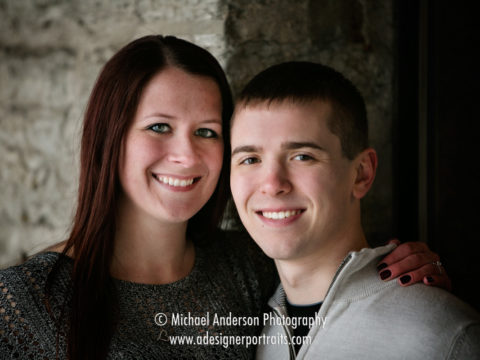 Close up portrait of Chris & Katelyn in one of their downtown Minneapolis engagement portraits.