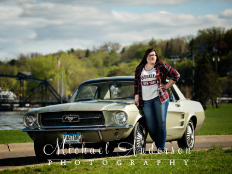 Kylie's cool high school senior portraits in Stillwater, MN. Photograph was taken standing by a 1967 Ford Mustang with a Tamron SP 150-600MM F/5-6.3 Di VC USD super telephoto lens.