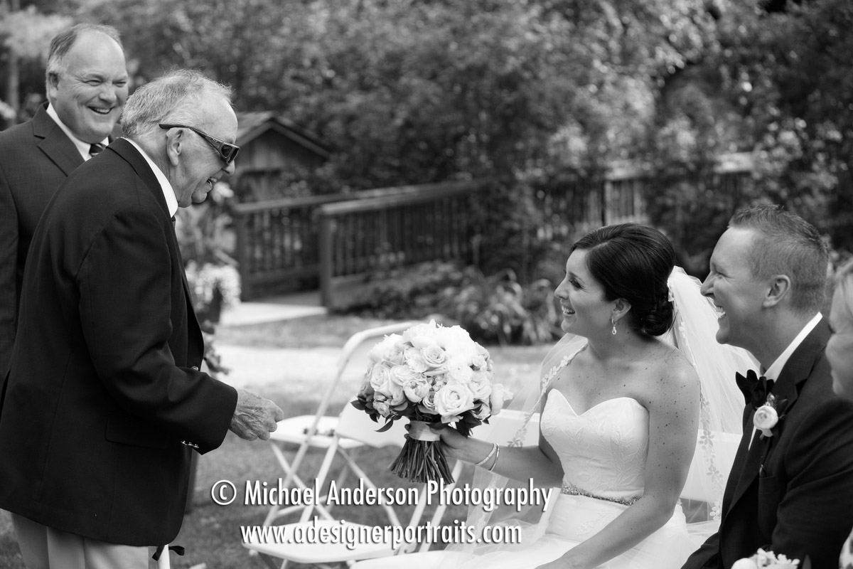 Fun B&W candid wedding photo of the bride's grandfather joking with his granddaughter and her soon to be husband. Image taken moments before their Grand View Lodge wedding in The Vineyard.