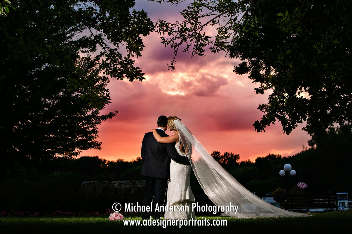 A stunning sunset wedding photograph of a bride & groom. Wedding photo taken during their Saint James Hotel wedding reception.