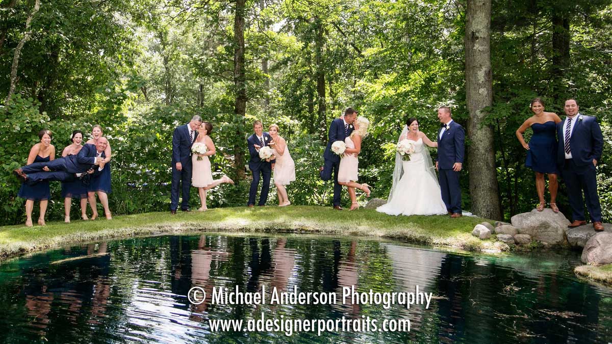 Bride & groom along with their wedding party at a pretty pond. Wedding photo taken before their Grand View Lodge wedding in Nisswa, MN.