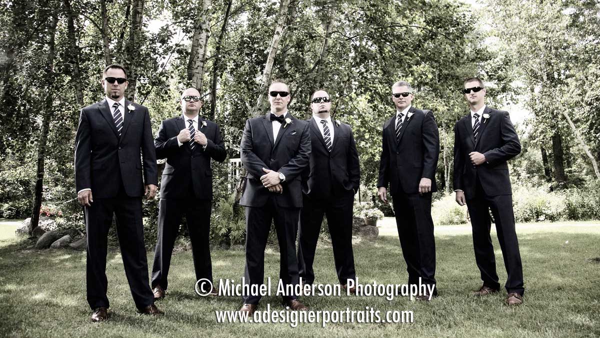 The groom and his groomsmen wearing sunglasses. B&W wedding photo taken by the Gull Lake Center before their Grand View Lodge wedding in Nisswa, MN.