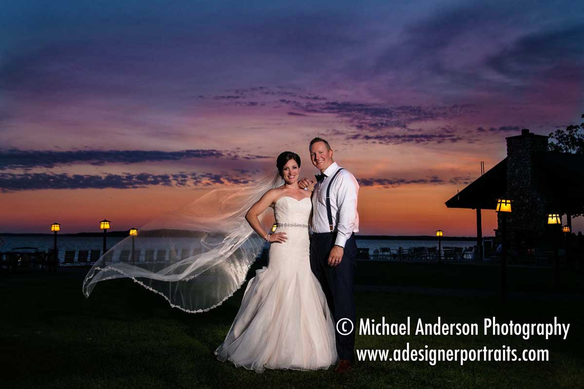 A very pretty sunset wedding photo of the bride & groom on the shores of Gull Lake in Nisswa, MN.
