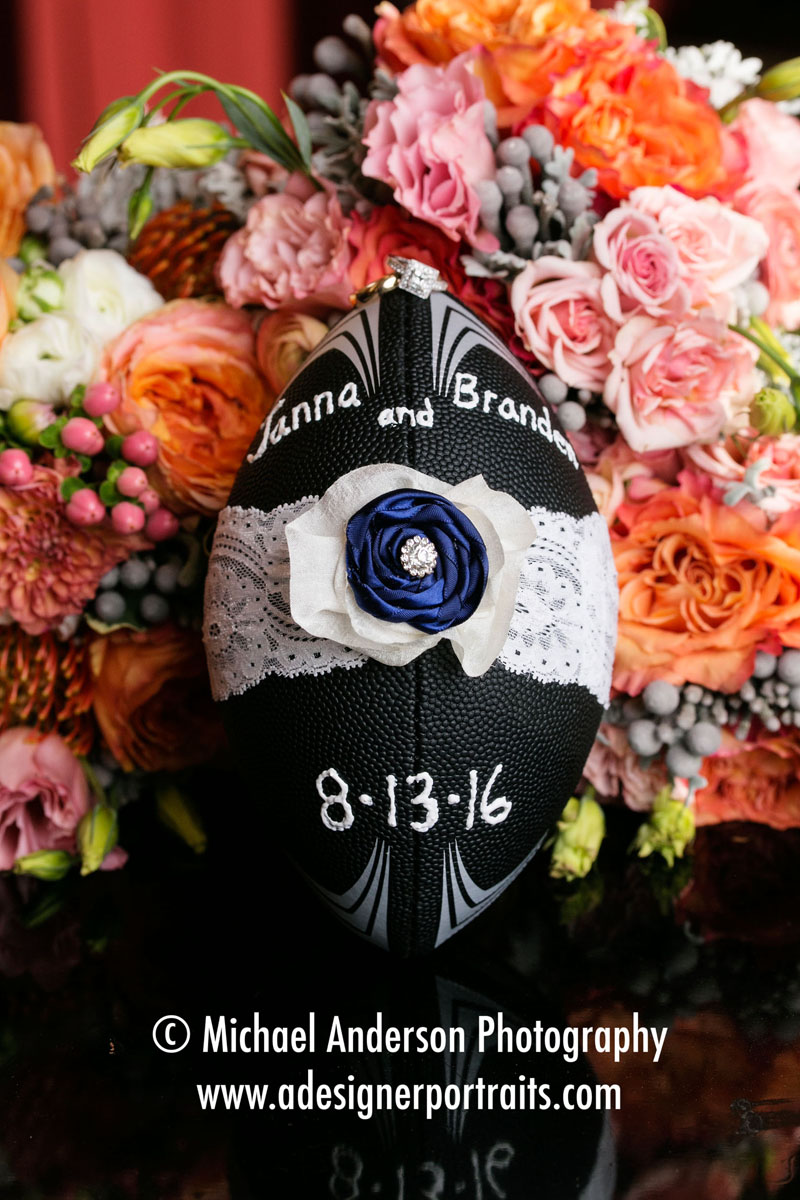 The bride's garter wrapped around a football for tossing at their Landmark Center wedding reception in Saint Paul, MN.