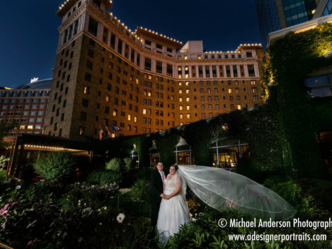 Light painted nighttime photo of the bride & groom in the gardens during The Saint Paul Hotel wedding reception.