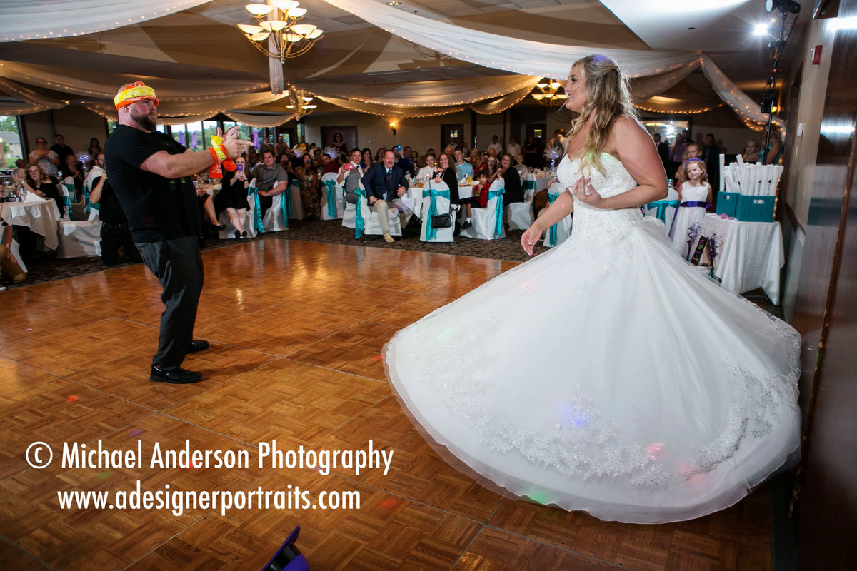 The bride & groom share a funny, choreographed first dance to begin their wedding reception. Wedding photography at The Wilds Golf Club Prior Lake MN.