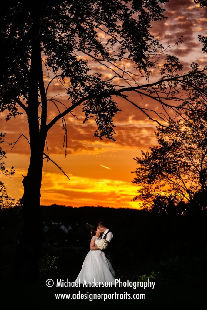 A stunning sunset wedding photo taken right outside the Holiday Inn & Suites parking lot in Lakeville, MN