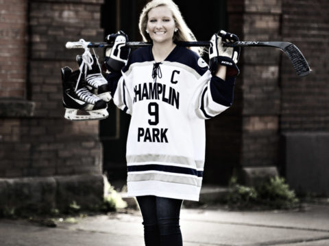 One of Maegan's Champlin Park High School senior portraits in her hockey jersey on the north shore of Lake Superior. Colorized B&W image was taken on a city street in Two Harbors, MN.