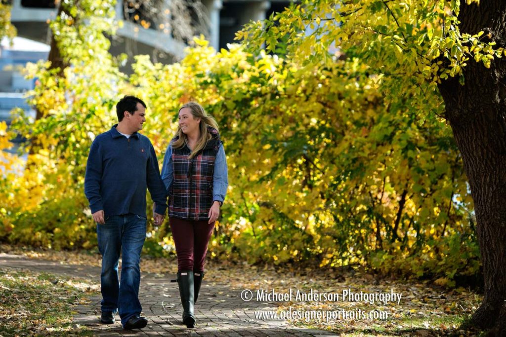 Aleks & Brycen take a stroll along the Mississippi River during the fall colors on St. Anthony Main in Minneapolis, MN.
