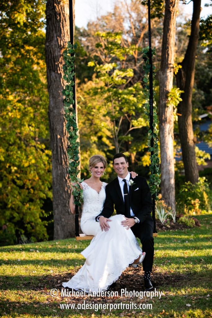 Bride & groom enjoying a quiet moment on a swing before their Mississippi Gardens wedding reception in Minneapolis, MN.