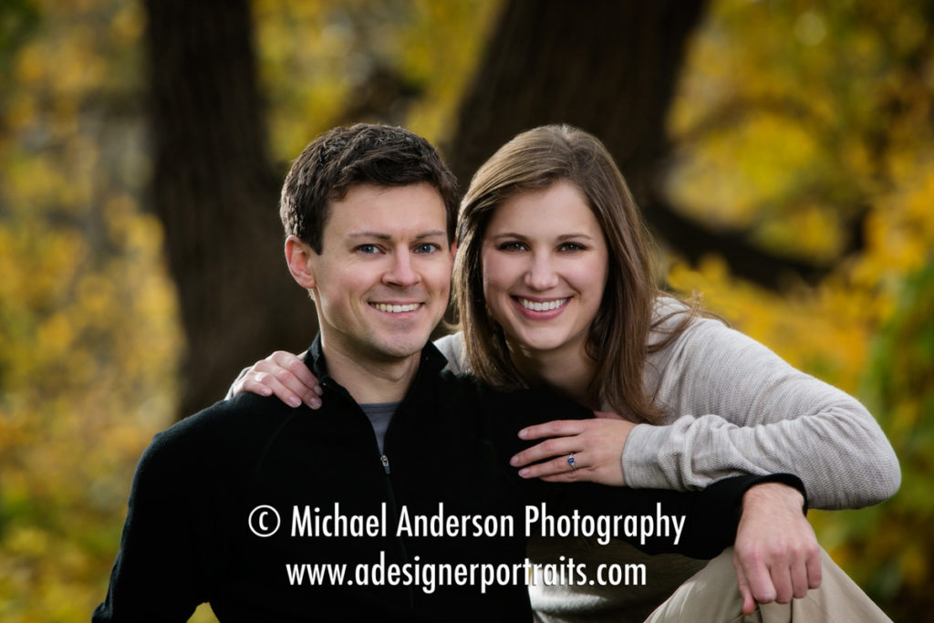 Beautiful fall color engagement portraits by the Stone Arch Bridge in Minneapolis, MN.