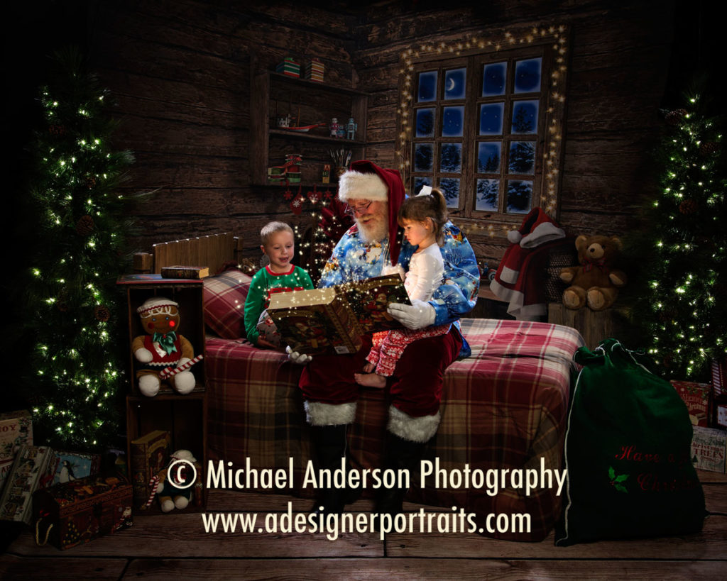 Santa Claus reading "The Night Before Christmas" to two very cute children wearing their Christmas pajamas. Adorable Santa Claus portrait created during their 2016 Portraits with Santa Claus.