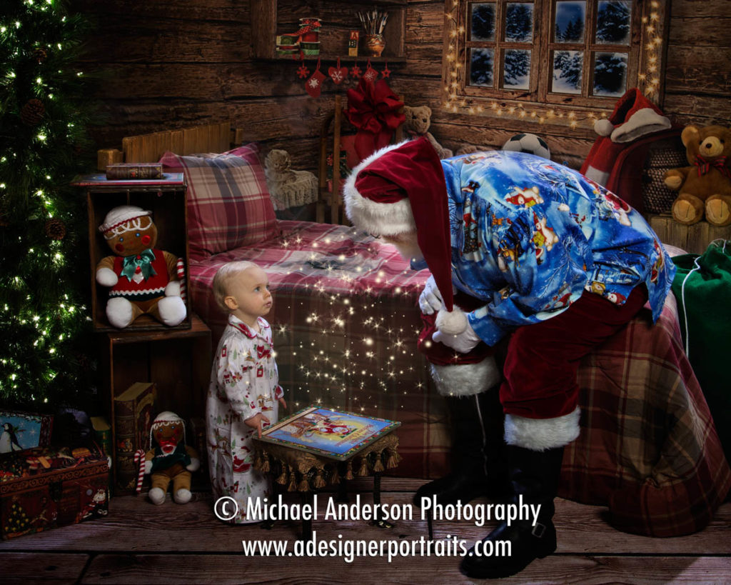An adorable one year old girl visits with Santa Claus while wearing her cute Christmas pajamas.