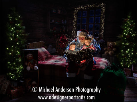 Santa reading "The Night Before Christmas" to two adorable kids during their Heirloom Christmas Portraits with Santa Claus 2016.