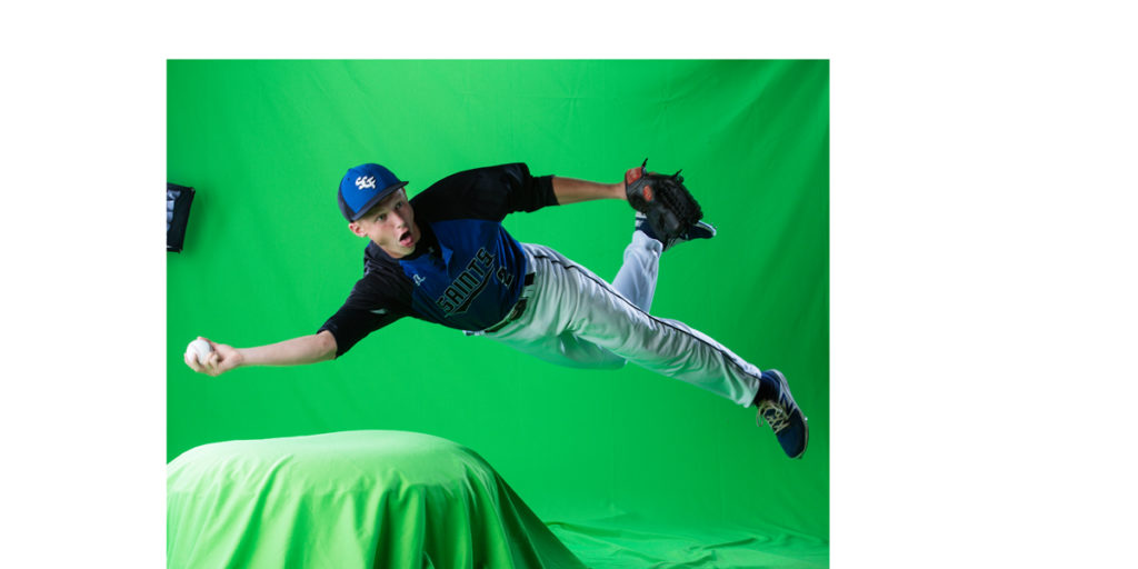 Saint Croix Falls High School baseball player taken on a green screen background. A baseball player is diving and making a throw. Image is before the green screen extraction has was done.