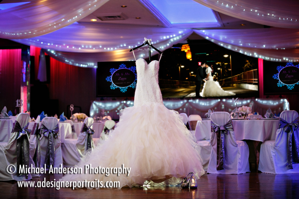 Kate's shoes & pretty wedding dress hanging in the Casablanca Ballroom at the Profile Event Center in Minneapolis, MN.