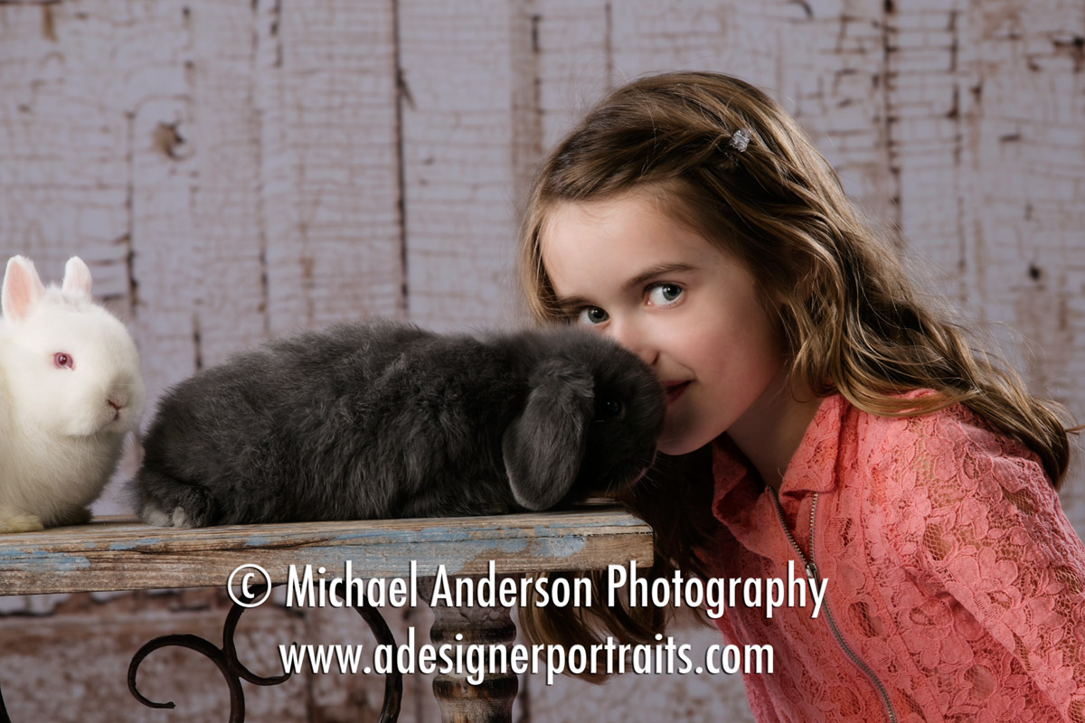 A cute seven year old girl has her 2017 Easter Portraits with Real Bunnies.