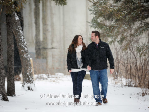 Very snowy engagement portraits taken in a snow storm at St. Anthony Main in downtown Minneapolis, MN.