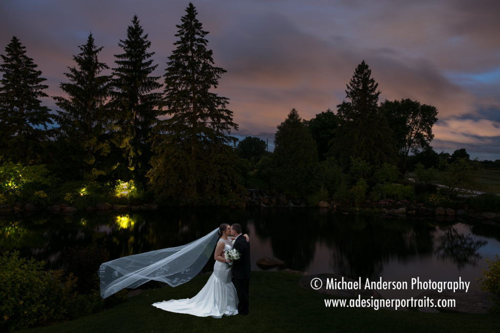 Derek & Zlata by the pond before light painting the whole scene at their Olympic Hills Golf Club wedding reception.