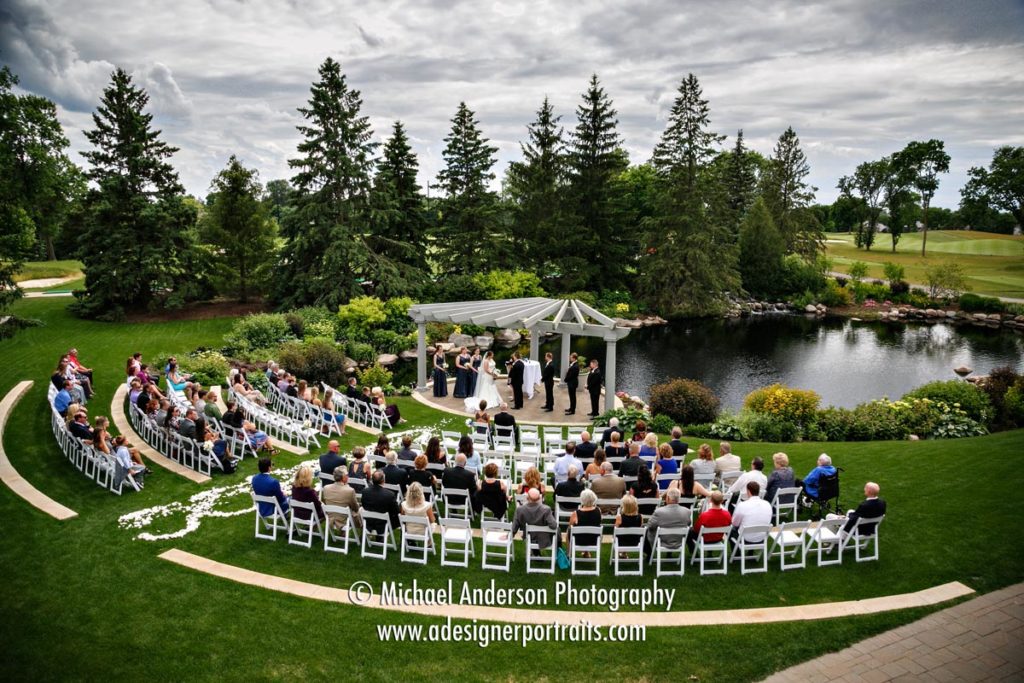 A very scenic Olympic Hills Golf Club outdoor wedding ceremony by a beautiful pond.