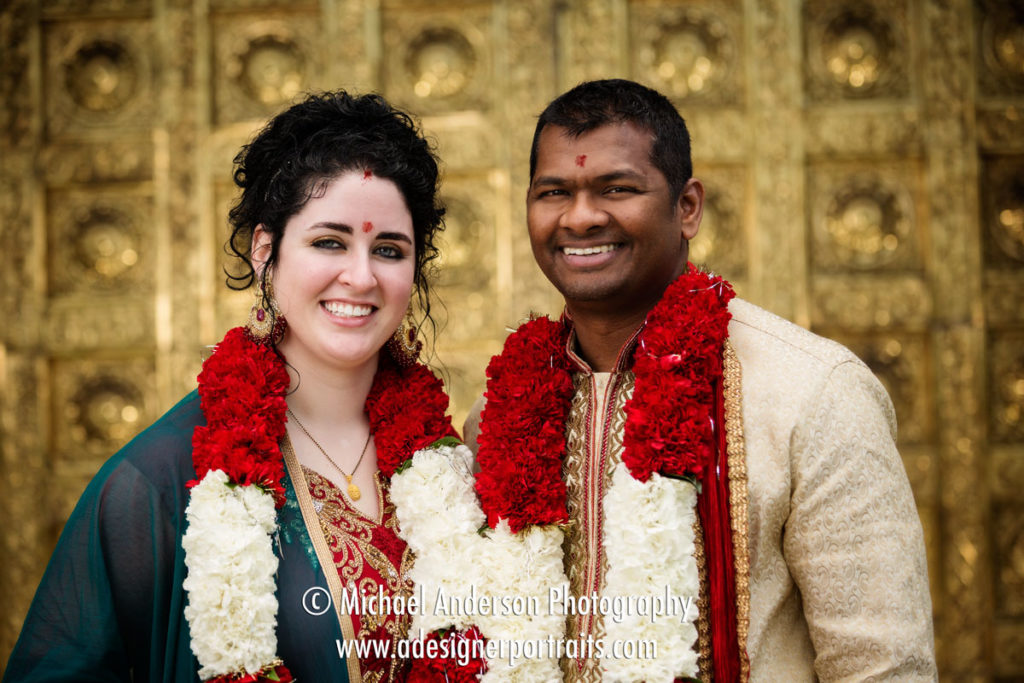 Pretty Spring Wedding Photos. Best Minneapolis Saint Paul MN Wedding Photos in 2017. Bride and groom in front of the gold doors at their Hindu Temple of Minnesota wedding.