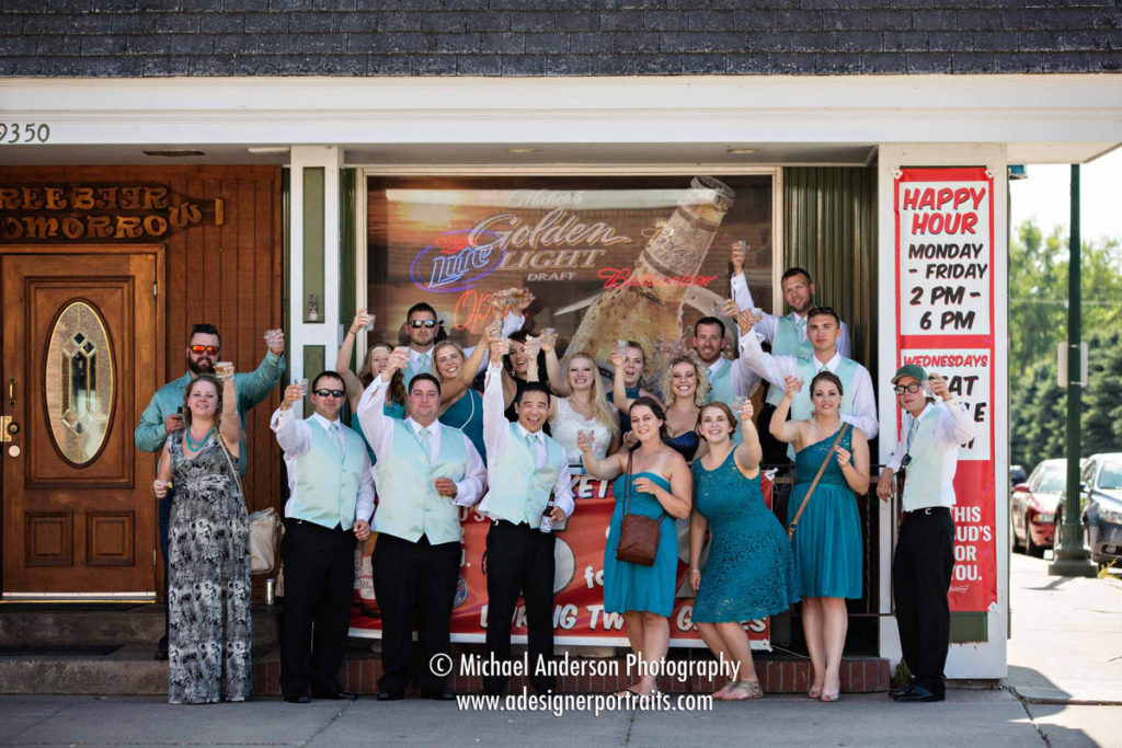 A fun wedding party photo taken outside of Scooter's Bar in Lindstrom, MN.