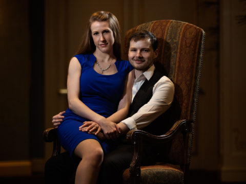 A classic sitting pose taken for the couple's engagement portraits at The Saint Paul Hotel.