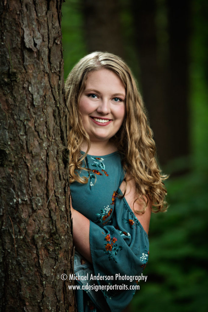 Pretty portrait of a senior girl in Lake Superior National Forest during her Lake Superior senior portraits.