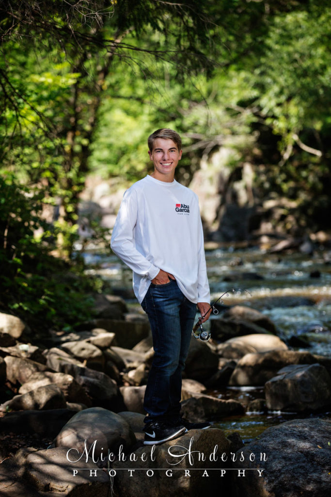 Ben's Lake Superior senior portraits taken while fishing on the Lester River in Duluth, MN.