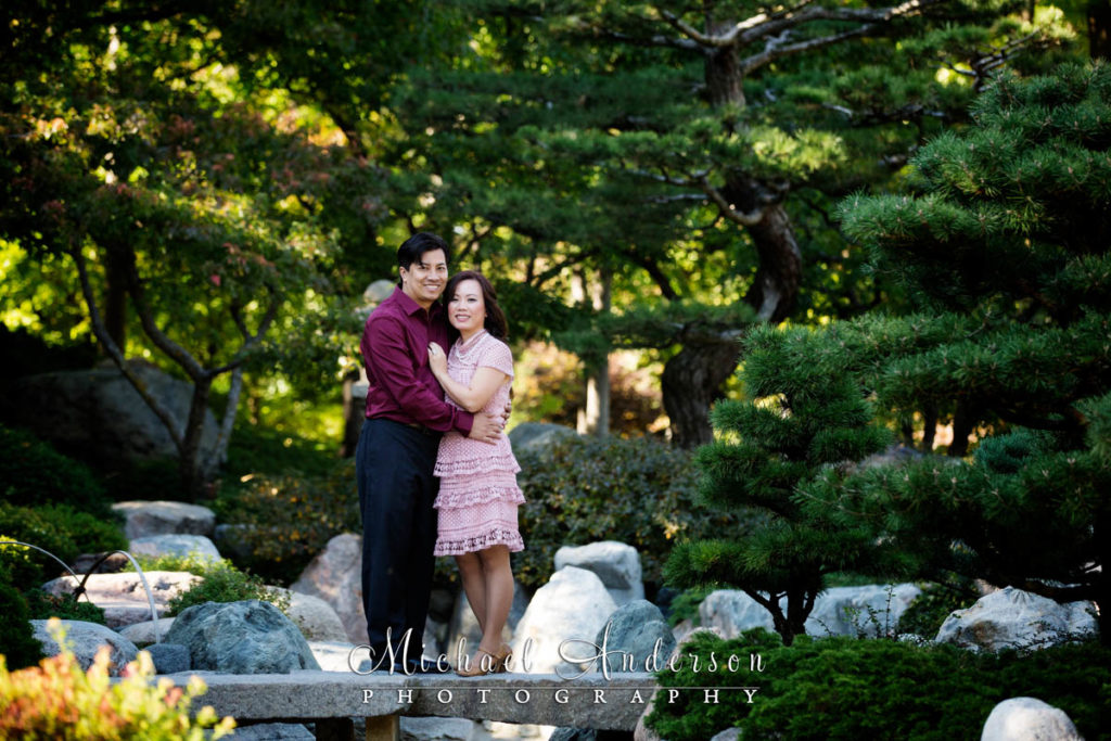Como Park engagement portraits of a cute couple on a foot bridge in The Charlotte Partridge Ordway Japanese Garden at Como Park.