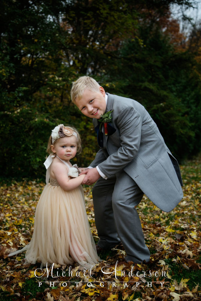 A very cute Minnesota Horse and Hunt Club wedding photograph of the ring bearer and the tiny flower girl.