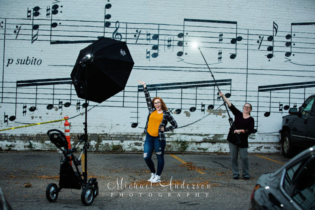 Behind the scenes photo of Morgan, her mom helping out as a lighting assistant, and our very own Lightning McQueen as the main light. This is just one of many of her senior portraits created all over Minneapolis, MN.