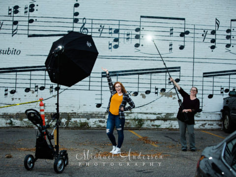 Behind the scenes photo of Morgan, her mom helping out as a lighting assistant, and our very own Lightning McQueen as the main light. This is just one of many of her senior portraits created all over Minneapolis, MN.