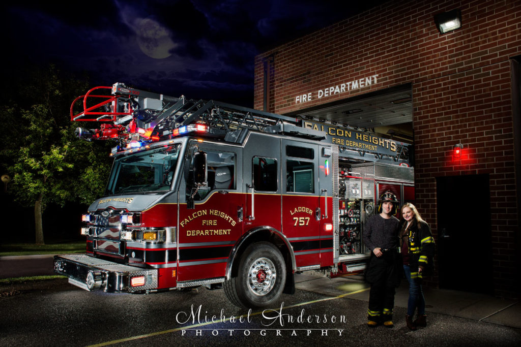 A stunning engagement portrait light painting of Ben and Emilee with Ladder 757 at the Falcon Heights Fire Station.
