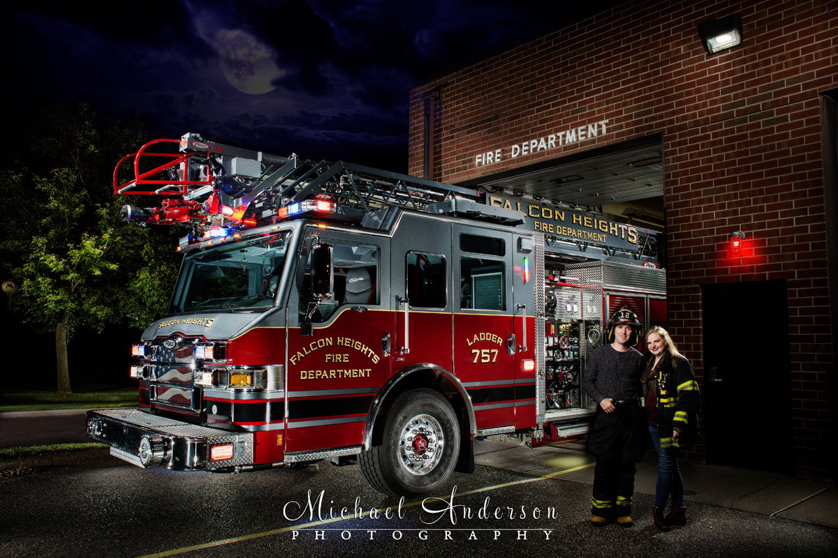 A stunning engagement portrait light painting of Ben and Emilee with Ladder 757 at the Falcon Heights Fire Station.